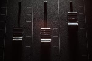 metal sliders adjusted at different points along bars