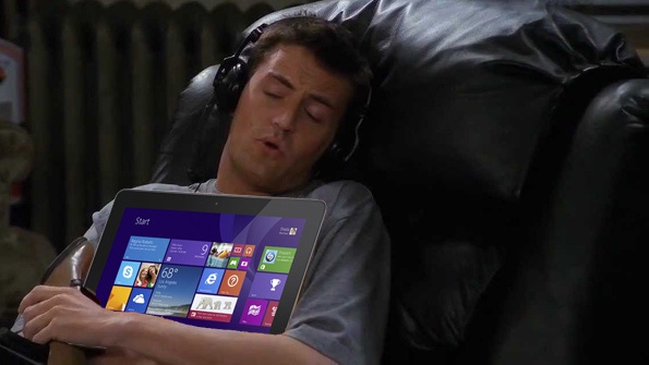 Photoshop of Friends Chandler Bing holding a Microsoft device
