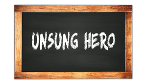 "unsung hero" written on a chalkboard "unsung hero" written on a chalkboard