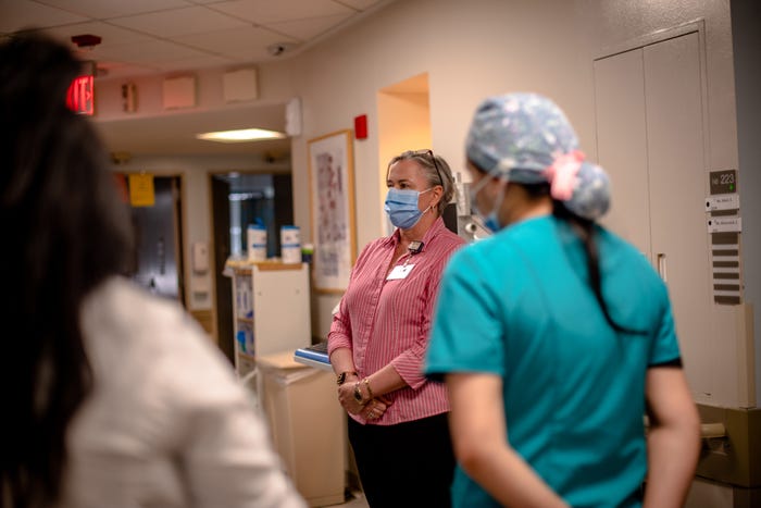 nurse talking with her staff