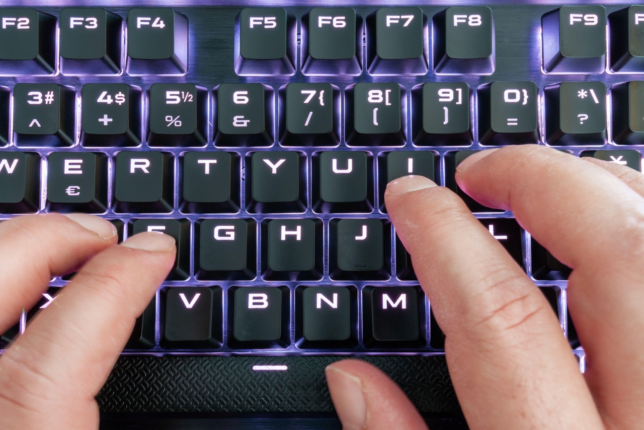 closeup view of a keyboard with bright led lights closeup view of a keyboard with bright led lights