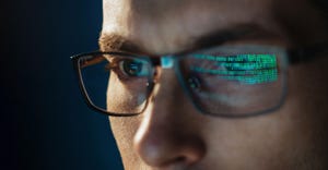 software engineer looking at code on a computer screen software engineer looking at code on a computer screen