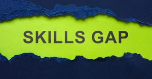 Skills Gap written under a torn piece of paper Skills Gap written under a torn piece of paper