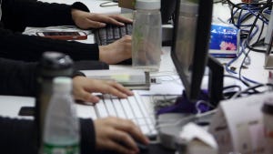 Workers use computers at their desks inside Tech Temple, a co-working space for start-up companies Photographer: Tomohiro Ohsumi Workers use computers at their desks inside Tech Temple, a co-working space for start-up companies Photographer: Tomohiro Ohsumi