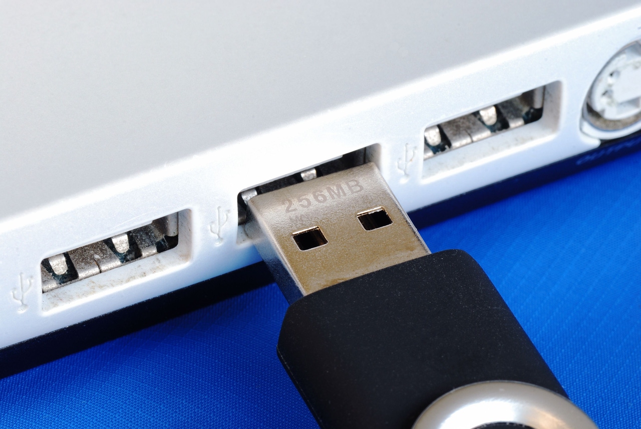 USB jump drive being plugged into computer USB jump drive being plugged into computer