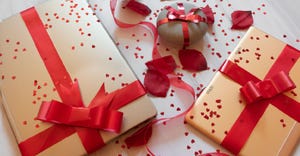 tech gifts wrapped with red bows