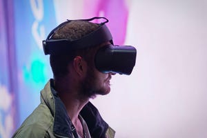 man wearing virtual reality goggles man wearing virtual reality goggles