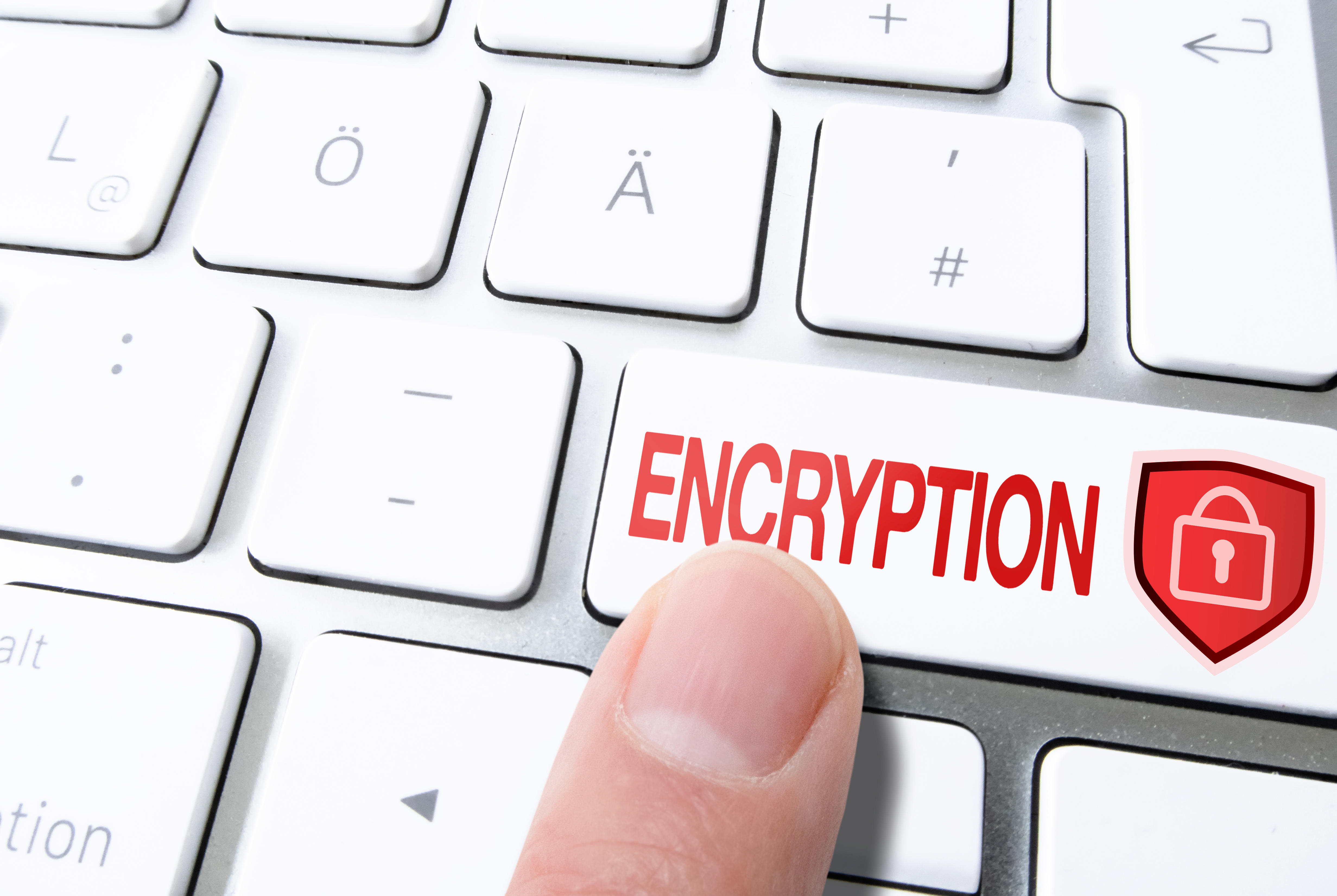 finger pressing red encryption key on keyboard