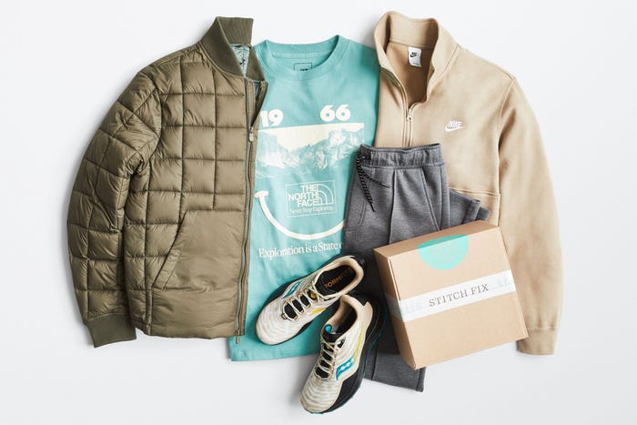 Five items of clothing and a cardboard Stitch Fix box