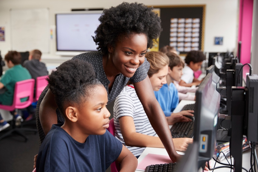 girls who code child coding on computer