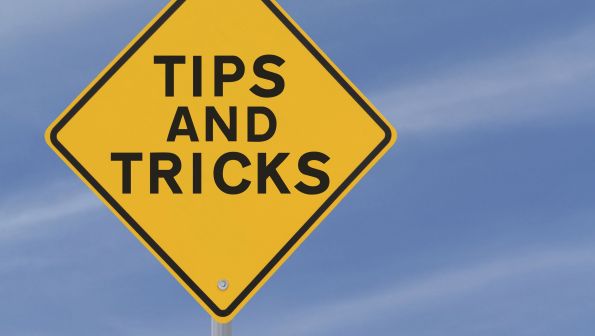 yellow road sign reading TIPS AND TRICKS yellow road sign reading TIPS AND TRICKS