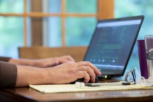 employee on laptop employee on laptop