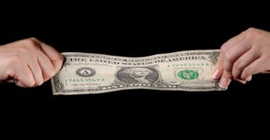 dollar bill being stretched dollar bill being stretched