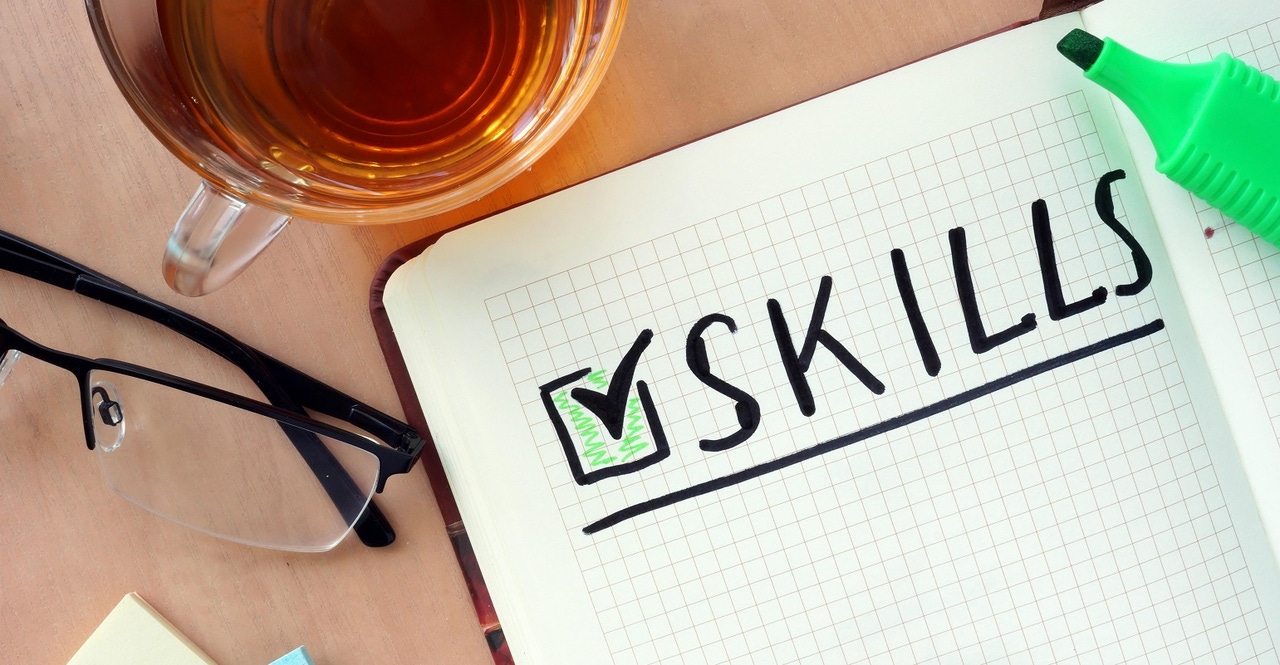 the word "skills" written on a piece of paper the word "skills" written on a piece of paper