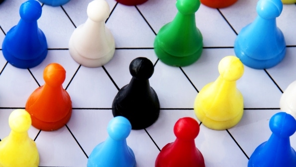 colorful game pieces on a game board colorful game pieces on a game board