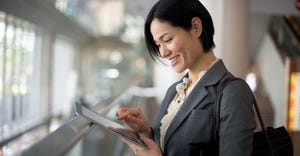 businesswoman looking at tablet