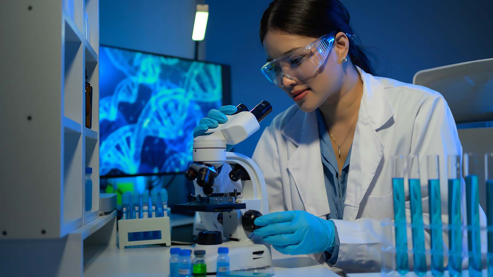 scientist with microscope