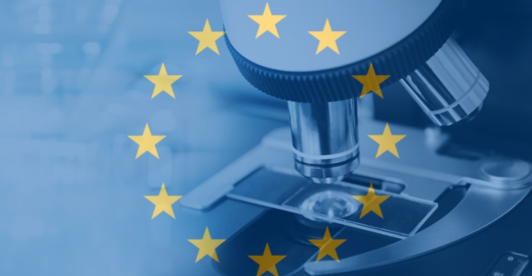 An illustration of the European Union flag overlaid on an image of a laboratory microscope