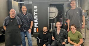 Westec Plastics staff poses in front of Mantle 3D printer.