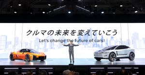 Toyota president and CEO Koji Sato, speaking onstage at the 2023 Japan Mobility Show.