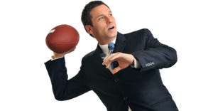 businessman throwing a football