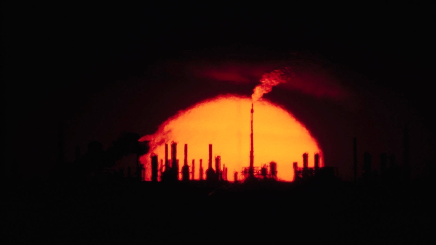 refinery under setting sun