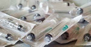 single-use syringes in plastic packaging