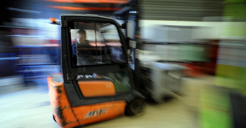 blurry image of forklift suggesting speed