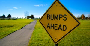bumps ahead road sign