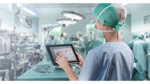surgeon using tablet