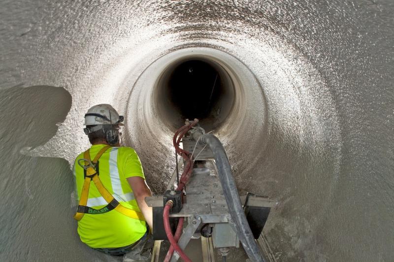 Spray-applied geopolymer liner used in large diameter sewer pipe repair technology
