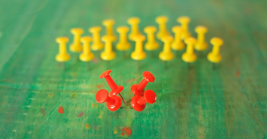 red and yellow push pins illustrating business concept