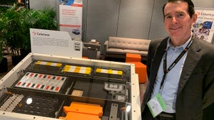 Tom Kelly, senior VP of engineered materials for Celanese, shows off an EV battery replica