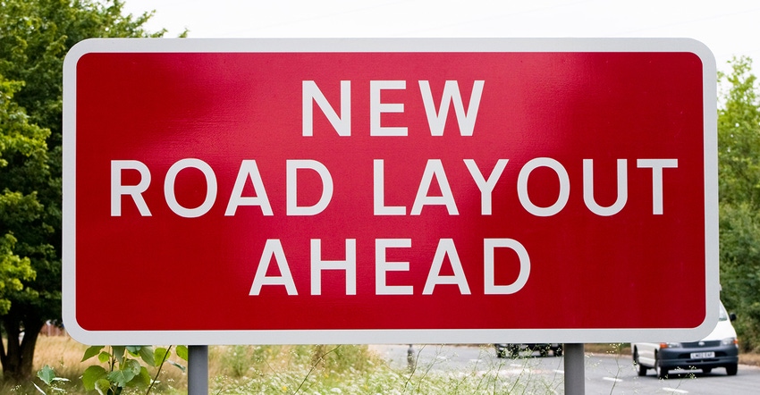 Sign saying new road layout ahead