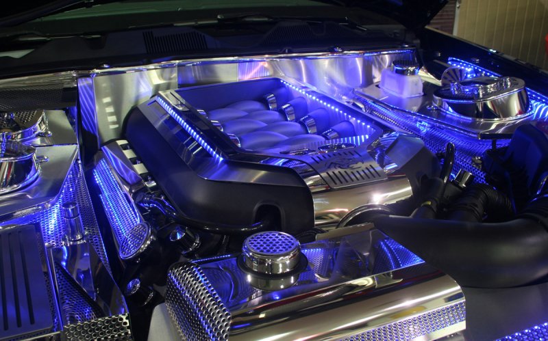 Illuminated engine cover lights up Mustang motor: chrome by day, blue by night