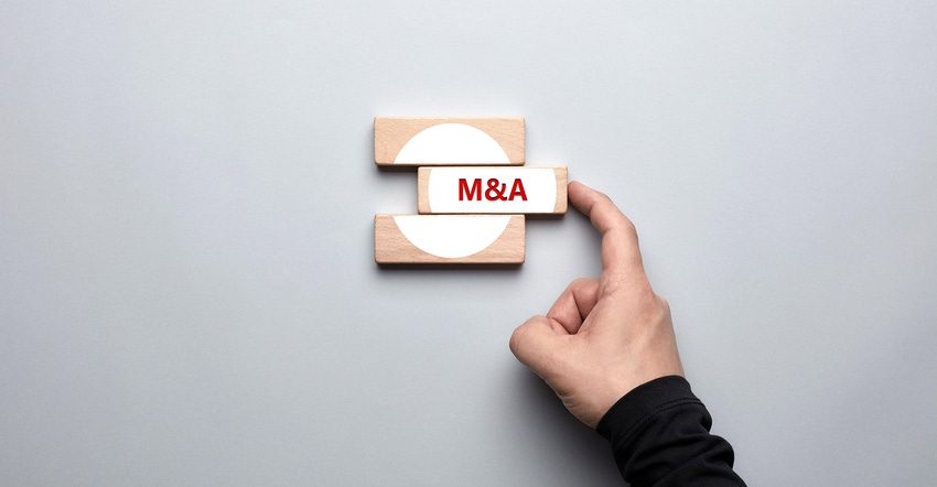 hand sliding M&A into wooden block
