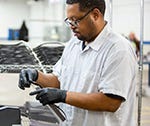 Ford worker assembling face mask