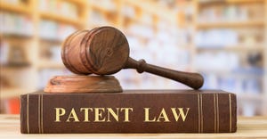 gavel sitting on patent law reference book