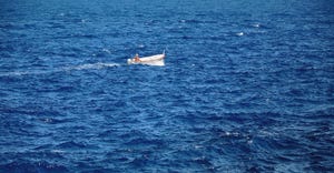 small boat in open sea