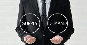 businessman balancing supply and demand