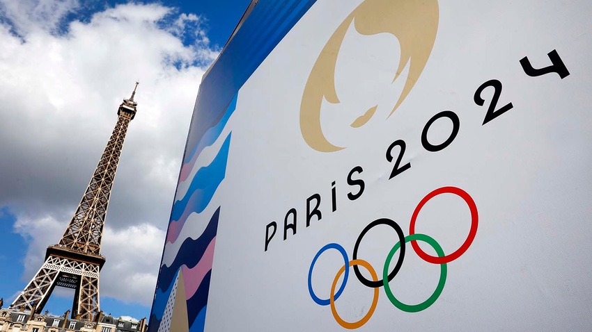 Paris Olympics sign in front of Eiffel Tower