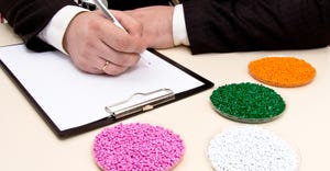 businessman signing contract to buy plastic resin