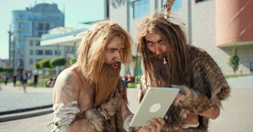 cavemen with laptop computer