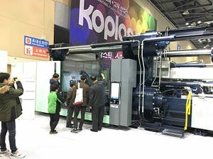Korean two-platen machine features retractable tie-bar