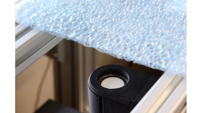 ultrasonic transducer inspecting plastic foam