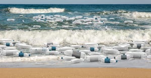 plastic water bottles washing up on beach