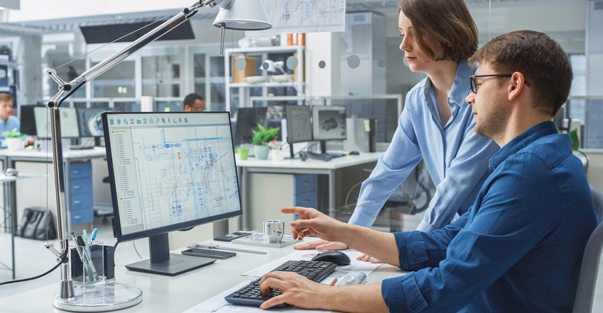 engineers in front of a computer