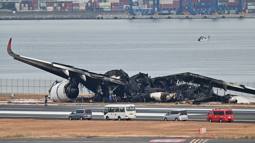 Burnt wreckage of Japan Airlines passenger plane