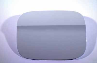 Online-paintable fuel filler flap made from PBT