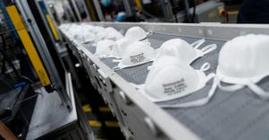 N95 masks on conveyor belt